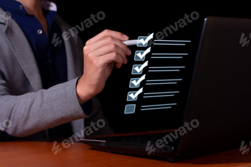 Preview: Businessman marks the checklist for document control, online product quality and business approval.
