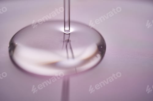 Preview: A juicy drop of gel on a purple background.