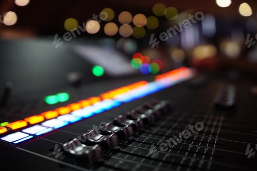 Preview: Closeup shot of an audio sound mixer with sliders buttons