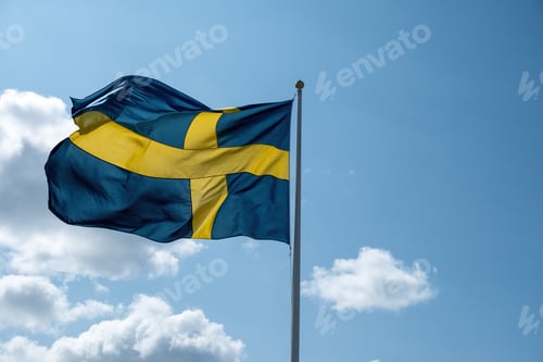 Preview: Sweden national flag waving on a flagpole, blue cloudy sky background