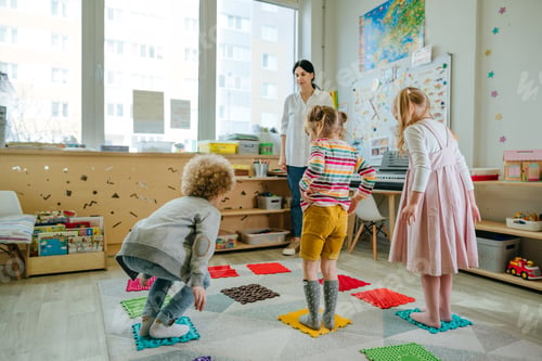 Preview: Preschool students having fun time jumping and walking on massage mats