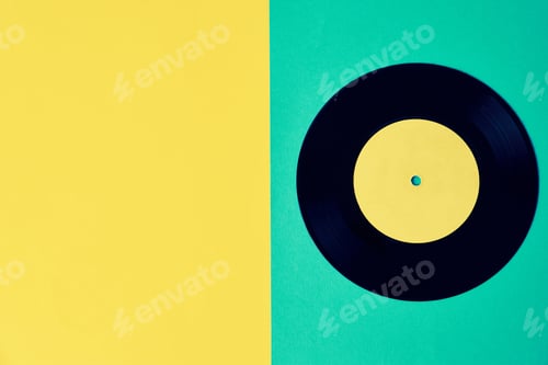 Preview: Old retro vinyl disc on the colored background. Vintage toned photo