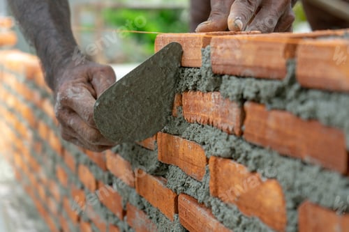 Preview: Worker uses trowel during installing the bricklayer wall