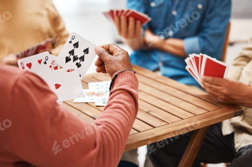 Preview: Senior friends, hands or playing card games on wooden table in fun activity, social bonding or gath