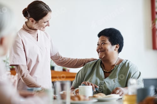 Preview: Caring Young Woman Working in Nursing Home