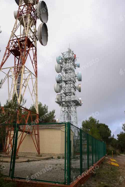 Preview: Vertical shot of a microwave antenna with the skies in the background