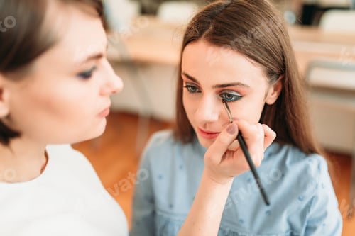Preview: Female make up artist work with woman face