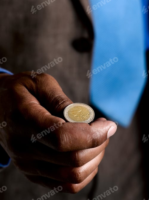 Preview: Business man ready to flip euro coin