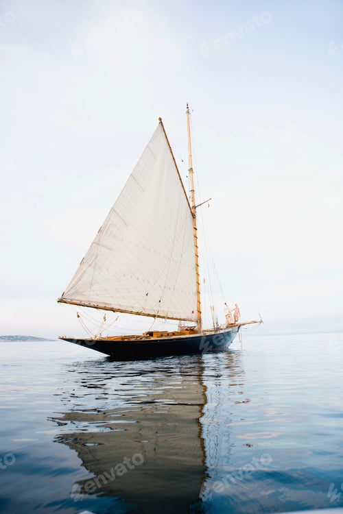 Preview: woman standing at rail of boat