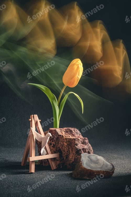Preview: concept spring. freakebana. yellow tulip and hummingbird. motion blur