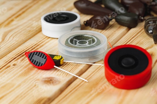 Preview: Fishing gear on wooden background close up