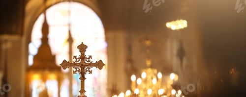 Preview: The cross standing on christian church and flare background.