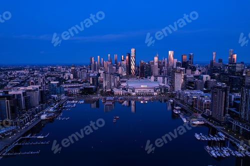 Preview: Aerial view of Melbourne's skyline at dusk, reflecting in the Yarra River
