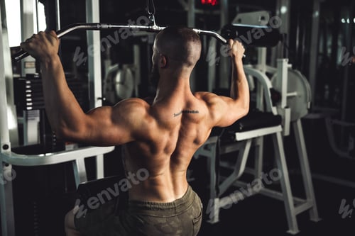 Preview: Man Doing Training On Machine For His Back Muscle At The Gym