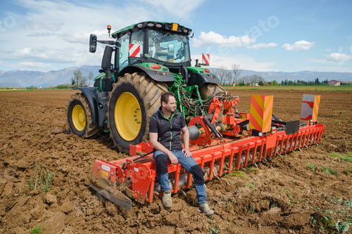 Preview: The hardworking men on the farm are proud of their farming machinery, as shown by their thumbs up in