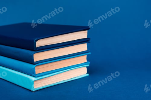 Preview: bright books on blue background with copy space