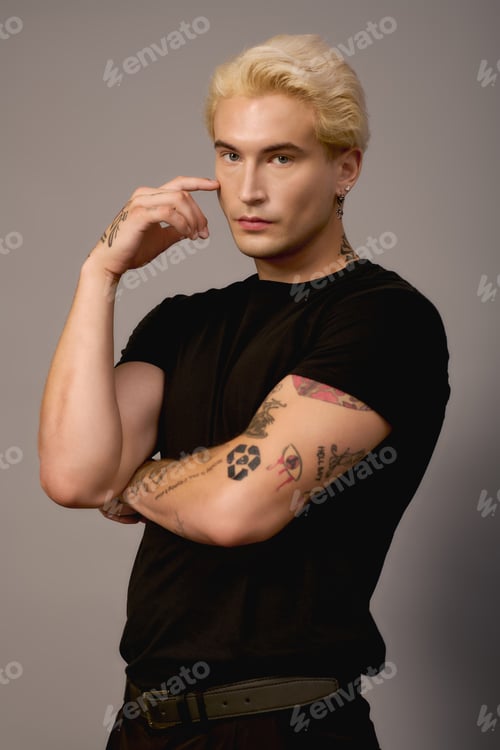 Preview: Stylish young man exuding confidence in a modern studio setting