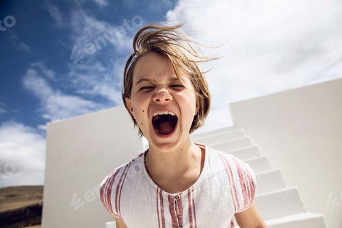 Preview: Girl with windswept hair, screaming out loud