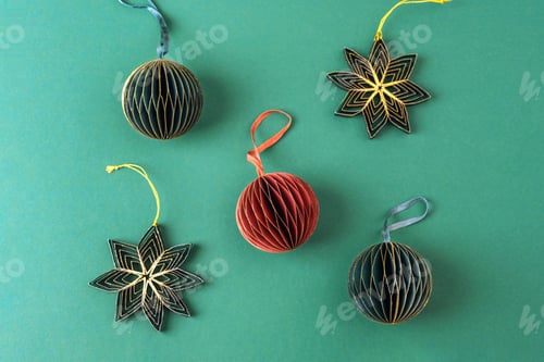 Preview: Paper fir tree toys on green background. Christmas concept. Top view, flat lay