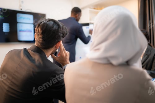 Preview: Multiethnic group of business people working together in a modern office