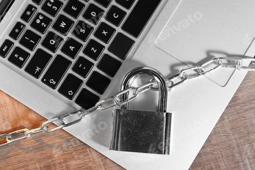 Preview: Cyber security. Laptop with padlock and chain on wooden table, top view