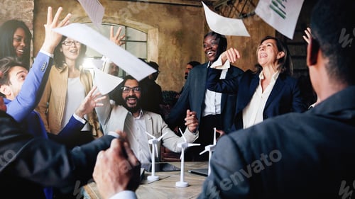 Preview: Multiracial group of business people celebrating inside office. Generational team, entrepreneur