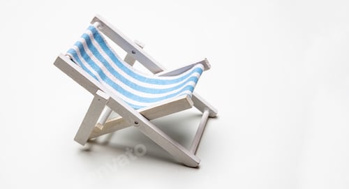 Preview: Deck chair, white blue striped beach chair isolated on white background.