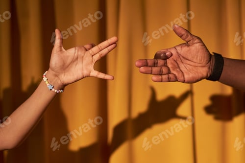 Preview: Hands playing shadow theater