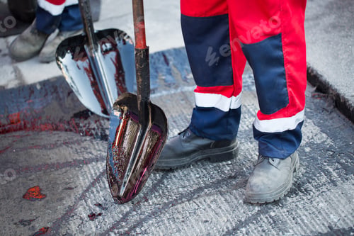 Preview: Repair of roads, highways and sidewalks. Patching. Working with a shovel falls asleep in the pit