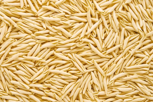 Preview: Food background. Dried trofie pasta from Liguria. Short twisted pasta, flat lay