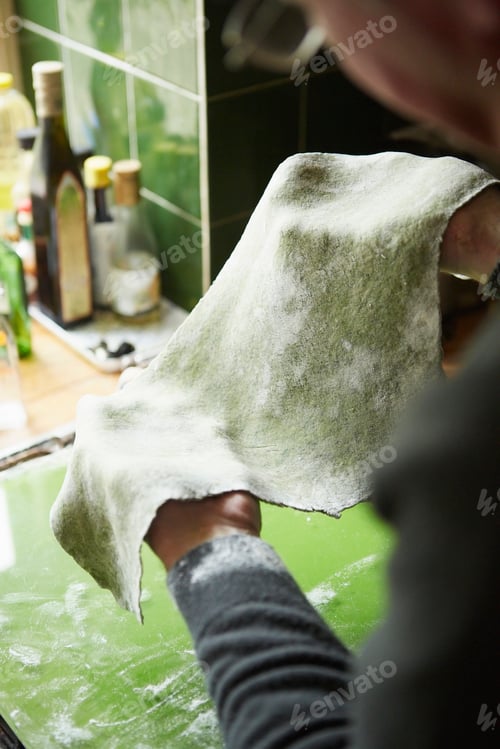 Preview: A man making fresh pasta with nettles and foraged plants.