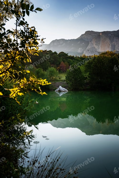 Preview: beautiful sunset on a mountain lake, suummer season