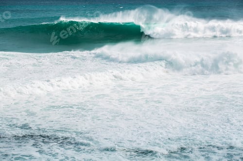 Preview: view from the beach to a tropical island and some granite rocks in the sea