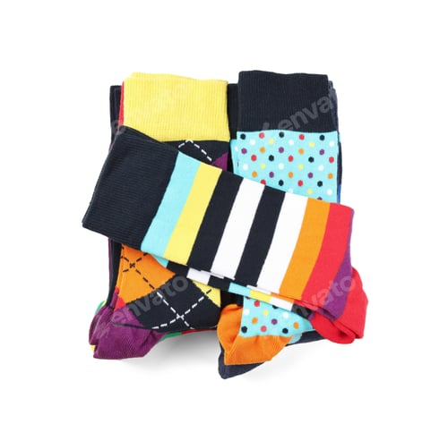 Preview: Colorful socks on white background, top view