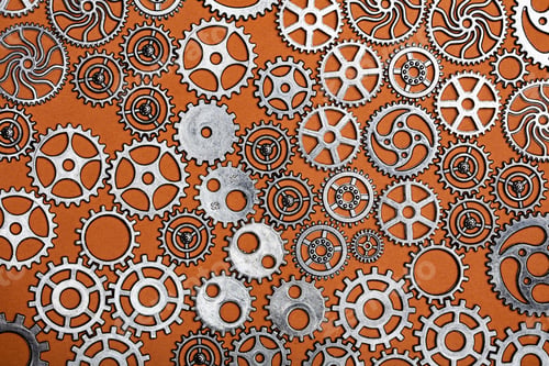 Preview: Bunch of cogwheels on an orange background.