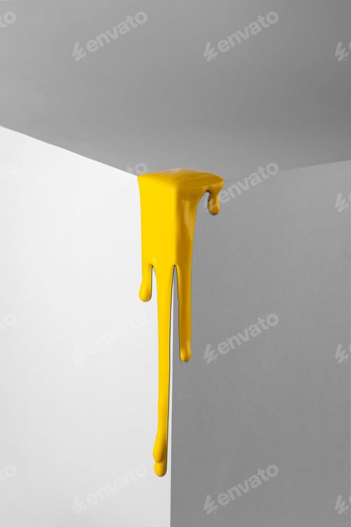 Preview: Yellow paint smudges on the corner of the gray cube. Repair concept.