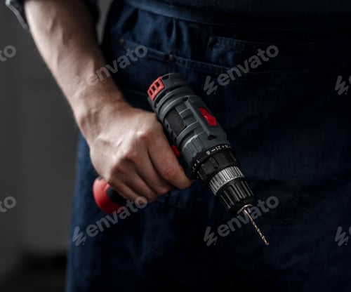 Preview: Man Holds Screwdriver