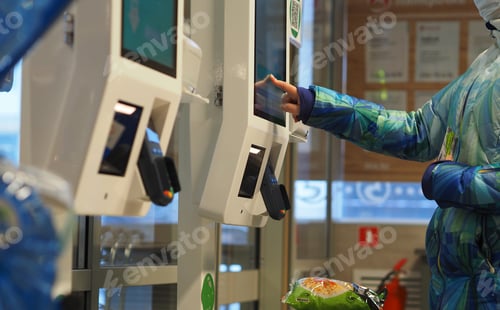 Preview: Shopping in the store. Pay with a bank card at the self-service terminal at the grocery store.