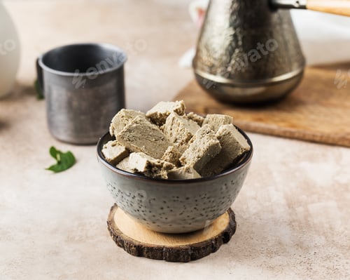Preview: Pieces of halva in bowl and a coffee turk. Oriental sweetness. Copy space.