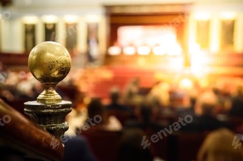 Preview: An old congress hall, unfocused in the background, where a talk is given during an business meeting.