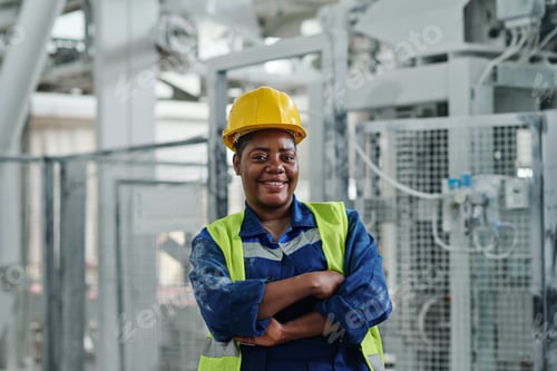 Preview: Young successful African American female worker of factory looking at you