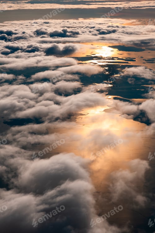 Preview: Watching the sunrise above the clouds from an airplane.