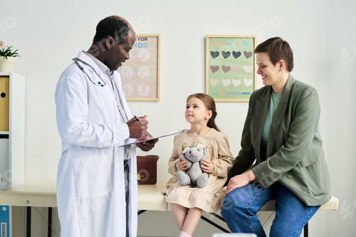 Preview: Doctor Examining Child with Parent in Pediatric Office