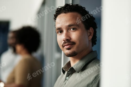 Preview: Shot of a handsome young businessman standing in the office during the day