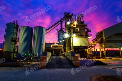 Preview: Old cement works with sunrise behind.