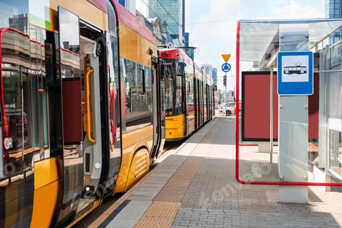 Preview: Modern streetcars near tram stop on sunny day. Public transport