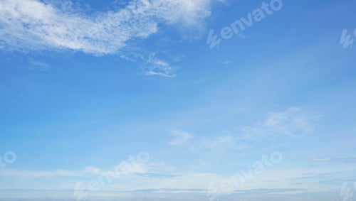 Preview: Blue sky and white cirrocumulus clouds texture background. Blue sky on sunny day. Beautiful blue sky