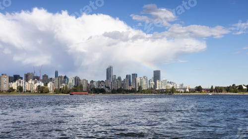 Preview: Downtown Vancouver City Skyline with clouds and rainbow.