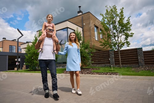 Preview: Photo of happy family on background of cottage and pines