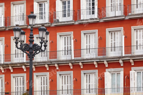 Preview: Classic red color facade in Madrid city center. Spain. Outdoor